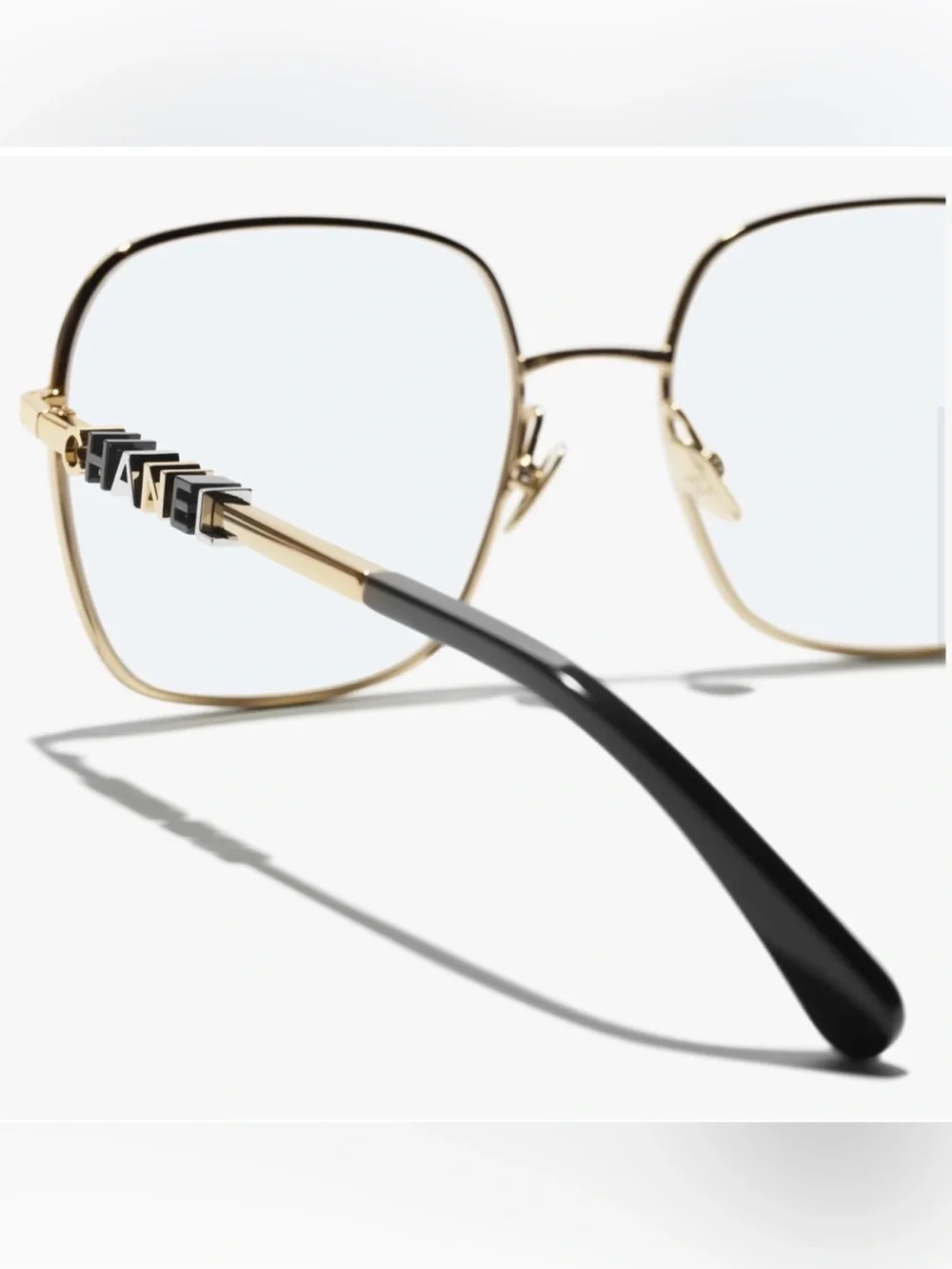 CHANEL Gold Frame Glasses with Black Temple Tips
